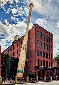                         A giant, REALLY giant, baseball bat outside the Louisville Slugger Museum and Factory in Louisville, Kentucky's largest city, along the winding Ohio River                        