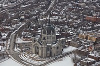                         Wintertime aerial view of downtown St. Paul, which--along with neighboring Minneapolis--is one of Minnesota's famous "Twin Cities." The focus is on the Roman Catholic Cathedral of St. Paul                        