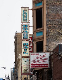                         Signs for the Brass Rail Cocktail Lounge and adjacent "adult boutique"  in downtown Minneapolis, which--along with neighboring St. Paul--is one of Minnesota's famous "Twin Cities"                        