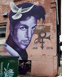                         Rock "Cyfi" Martinez's 2016 tribute mural to the mega-star singer Prince on a building in uptown Minneapolis, which--along with neighboring St. Paul--is one of Minnesota's famous "Twin Cities." Prince, born Prince Rogers Nelson in Minneapolis, had, according to a medical examiner, died earlier that year of an accidental overdose of fentanyl, a synthetic opioid pain reliever, at age 57                        