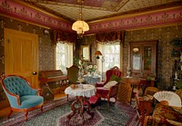                         An elegant parlor of the Riley County Historical Museum's Wolf House historical museum in Manhattan, Kansas                        
