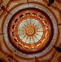                         The striking ceiling of the rotunda, surrounded by Abner Crossman's circle of murals, inside the Kansas Capitol, often called the Kansas Statehouse locally, in Topeka                        