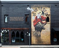                         This mural of a mystical-looking man on an ox, created by local artist Brad Noble with assistance from artists Francois Lariviere and Emily Million decorates a wall in downtown Springfield, the largest city in the southwest quadrant of Missouri that includes the state's share of the Ozark Mountains (Arkansas has the other)                        