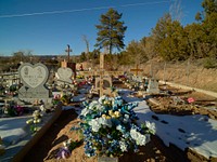                         The Rio Chiquito Cemetery, a small, colorful community graveyard near the southern end of what's called the "High Road," a winding route through the Sangre de Cristo mountains to and from the New Mexico capital city of Santa Fe and the art and shopping mecca of Taos                        