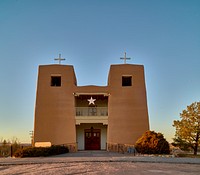                         The Sacred Heart Catholic Mission Church, last restored in 1974 after almost three centuries of existence in various forms at the Nambé Pueblo, settled by one of New Mexico's Tewa-language tribes in the 14th century, 15 miles north of what is now the state capital of Santa Fe, near the southern end of the winding "High Road" to the art and shopping mecca of Taos                        