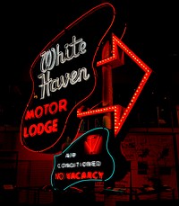                         Vintage motel neon sign preserved at the Johnson County Arts & Heritage Center in Overland Park, one of the suburban cities surrounding Kansas City, Kansas, which itself is a "sister city" of the larger Kansas City, Missouri, to the east                        