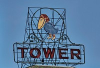                         One of two similar neon signs above Jayhawk Tower Business Center in downtown Topeka, the capital city of Kansas                        