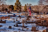                        The Sierra Vista Cemetery, one of 10 small graveyards in Taos, New Mexico, once a sleepy southern Sangre de Cristo Mountains town, inhabited by Native Americans for centuries, that has grown into an art colony, filled with museums and dozens of shops, that is now a worldwide tourist attraction                        
