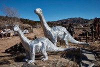                        Metal-art dinosaurs displayed outside the Casa Cristal Pottery home-and-garden roadside store near Velarde in northern New Mexico                        