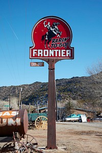                         Frontier Gasoline station sign at a nostalgic roadside attraction, the Classical Gas Museum, in the Rocky Mountain foothills of northern New Mexico, near the town of Dixon                        