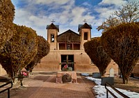                         Dusk view of El Santuario de Chimayo, a Roman Catholic church on ground that was a worship space even before its construction in 1813 in Chimayo, a New Mexico village on the "High Road," a winding route through the Sangre de Cristo Mountains                        