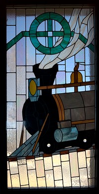                         An elaborate stained-glass window depicting a steam locomotive, down to the steam itself, at the 1910 Las Cruces, New Mexico, train depot                        