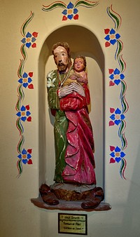                         A carving, "Saint Joseph, Husband of Mary," at the Santo Niño Prayer Portal, a separate building from the nearby Santo Niño de Atocha children's chapel, in Chimayo, a small town and cluster of colorful plazas or placitas, each with its own name on what's called the "High Road," a winding route through the Sangre de Cristo Mountains to and from the capital city of Santa Fe and the art and shopping mecca of Taos                        