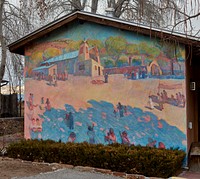                         A colorful mural depicting the El Santuario de Chimayo, a humble but incredibly popular shrine in Chimayo, a New Mexico village on the "High Road," a winding route through the Sangre de Cristo Mountains to and from the capital city of Santa Fe and the art and shopping mecca of Taos                        