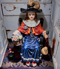                         A doll-like figure of Santo Niño, Jesus Christ as a young boy, at El Santuario de Chimayo, a humble but incredibly popular chapel in Chimayo, a New Mexico village on the "High Road," a winding route to and from the capital city of Santa Fe and the art and shopping mecca of Taos                        