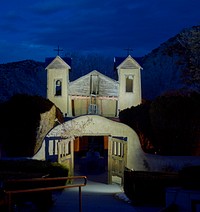                         Early evening view of the El Santuario de Chimayo, a humble but incredibly popular shrine in Chimayo, a New Mexico village on the "High Road," a winding route through the Sangre de Cristo Mountains to and from the capital city of Santa Fe and the art and shopping mecca of Taos                        