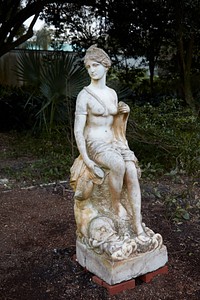                         Marble statue near the entrance to Houmas House and Gardens, a Louisiana plantation-era attraction that includes visitor lodging, restaurants and a bar, and the most extensive gardens in "Plantation Country" along the winding Mississippi River Road near the tiny town of Darrow in Ascension Parish                        
