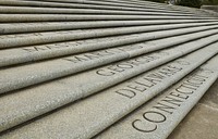                         A monumental stairway consisting of 49 granite steps leading to the front entrance of the Louisiana State Capitol in Baton Rouge, one of America's best-known statehouses for two reasons as it is the tallest (the skyscraper-like building rises 34 stories), and it was here that one of the nation's most famous (some would say notorious) governors, populist Huey Long, was assassinated in 1935                        