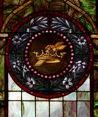                         Detail of one of the stained-glass windows inside Williamson Chapel, adapted from an early schoolhouse to represent small country churches, stands at Cannonsburgh Village, a reimagined southern village composed of buildings moved from locations throughout the American mid-South to the site in Murfreesboro, Tennessee, beginning in 1974 as part of one of 16 U.S. Bicentennial Projects (prepared for the bicentennial year of 1976)                        