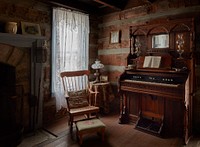                         An interior view of the Leeman House, a circa-1820s two-story log structure at Cannonsburgh Village, a reimagined southern village in Murfreesboro, Tennessee, composed of buildings moved from locations throughout the American mid-South (this one from eastern Rutherford County, Tennessee) to the site beginning in 1974 as part of one of 16 U.S. Bicentennial Projects (prepared for the bicentennial year of 1976)                        