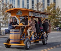                         One of dozens of pedal-powered mobile bars that carry party-hardy tourists past the Johnny Cash Museum in the honky-tonk Lower Broadway neighborhood of Nashville, the capital city of the mid-South U.S. state of Tennessee                        