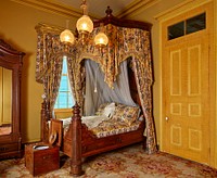                         A richly decorated bedroom at San Francisco Plantation house, built in the 1850s on land now (as of 2021) on Marathon Oil Refinery grounds along the Mississippi River in John the Baptist Parish, Louisiana                        