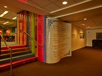                         A lower-level corridor wall of the Kansas City Central Library, the main downtown library in Missouri's largest city, carries forth a "bookshelf" theme more prominently displayed outside, on the wall of the library's parking garage                        