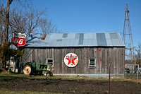                         A rural barn, decorated with vintage gasoline signs, in Randolph County, Missouri                        