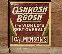                         Vintage Oshkosh B'Gosh overall company advertising sign on a wall in downtown Aberdeen, a small city in northeast South Dakota that was founded by a railroad executive whose boss was born in Aberdeen, Scotland, hence the choice of the new town's name                        