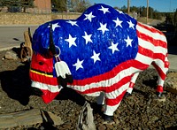                         A colorfully decorated buffalo, or American bison, sculpture on the street in Custer, South Dakota                        