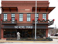                         The Hotel Sturgis in Sturgis, South Dakota, a city of fewer than 7,000 population (as of 2021) in the Black Hills made famous by its array of "biker bars" and its role as host to both the annual Sturgis Motorcycle Rally and the activity's hall of fame                        
