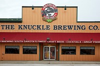                         The Knuckle Brewing Company craft-beer emporium in Sturgis, South Dakota, a city of fewer than 7,000 population (as of 2021) in the Black Hills made famous by its array of "biker bars" and its role as host to both the annual Sturgis Motorcycle Rally and the activity's hall of fame                        