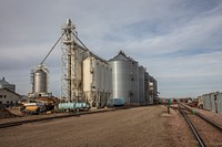                         An array of modern metal silos beside a railroad spur in Fort Pierre, a small city across the Missouri from the South Dakota capital city of Pierre, both of which are pronounced "Peer" rather than the expected "Pee-AIR"                        