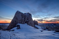                         Late-December sunset view of western South Dakota's Badlands National Park, southeast of Rapid City, when the region's stark rock formations get dustings of snow and also dangerous full-scale blizzards                        