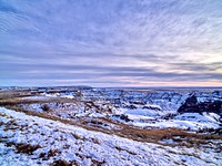                         Late-December view of western South Dakota's Badlands National Park, southeast of Rapid City, when the region's stark rock formations get dustings of snow such as these and also dangerous full-scale blizzards                        