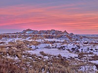                         Late-December view of western South Dakota's Badlands National Park, southeast of Rapid City, when the region's stark rock formations get dustings of snow such as these and also dangerous full-scale blizzards                        