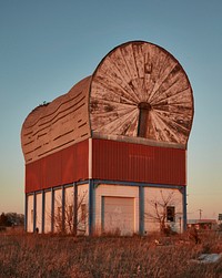                         Now long-closed and minus its wheels and adjacent cowboy figure, this old gas station in Milford, Nebraska, was long touted as "the World's Largest Covered Wagon"                        