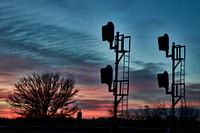                        Sunset view of railroad signals along the Grand Island railroad line in Chapman, Nebraska                        