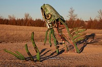                         Odd metal art adjacent to the Carhenge outdoor monument to automobiles near Alliance in northwest Nebraska, built to mimic the world-famous Stonehenge prehistoric monument on England's Salisbury Plain                        