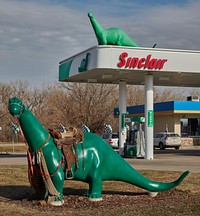                         One of this Sinclair Oil Co. gas station's model dinosaurs (the company logo) looks on, apparently approvingly, at another, saddled up western-style in North Platte, a key city in southwest Nebraska                        