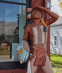                         A Native American scout-like figure outside the Furnburg Store, a frontier general store built near the Great Northern Railroad tracks in 1871, is displayed at Bonanzaville, an outdoor history museum of the Cass County Historical Society in West Fargo, North Dakota                        