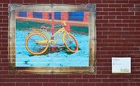                         Kevin Zepper's 2017 artwork, entitled "Yellow Bicycle," on a brick wall of the Kassenburg Building in Fargo, North Dakota, the state's largest city, on its eastern border with Minnesota                        