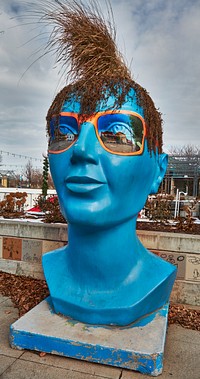                         Among the most unusual pieces of public art in Grand Forks, the principal city in northeast North Dakota and the home of the University of North Dakota, are (as of 2021) three six-foot-tall depictions of human heads (including this one), which double as planters                        