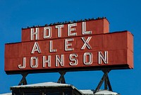                         The simple but historic sign above the iconic Hotel Alex Johnson, long a landmark and now (as of 2021) a Hilton chain boutique hotel in Rapid City, the principal metropolis in far-western South Dakota, within that state's portion of the Black Hills range                        