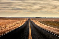                         A rolling Nebraska country road between December snowstorms, near the little village of Keystone                        