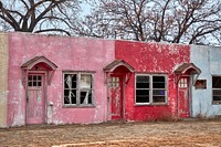                         A very, very old, long-abandoned motel whose colorful facade remains strikingly visible (if fading), in the tiny village (population just over 100) in southwest Nebraska                        