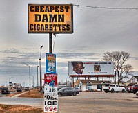                         "Cheapest Damn Cigarettes" is not only a promotional slogan on a sign outside a roadside tobacco and alcohol store, it's also the name of the store itself in Lincoln, the capital city of the midwest-U.S. state of Nebraska                        