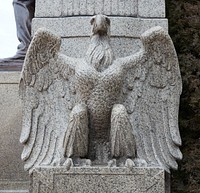                         A decorative stone eagle below a column on the capitol building in Lincoln, the capital city of the midwest-U.S. state of Nebraska                        