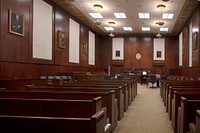                         The John A. Campbell U.S. Courthouse in Mobile, Alabama is a white, limestone building resting on a granite base, built in the relatively austere Neo-Classical Revival style                        