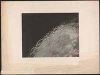 [Image showing a quarter of a celestial body, showing craters]